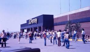 A vintage JCPenney department store exterior, circa mid-20th century, reflecting the brand's century-long identity in American retail